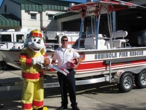 Sparky the Fire Dog and Seminole Fire Rescue District Chief Lance Volpe ask you to come out and “Fill the Fire Boat with toys for underprivileged children December 16 at the Seminole Walmart at Bay Pines.