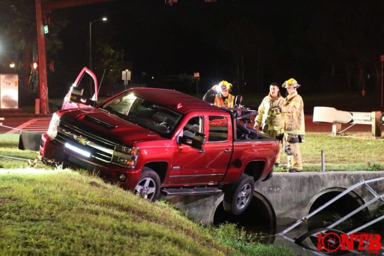 Firefighters rescue two occupants of a truck in Pinellas Park