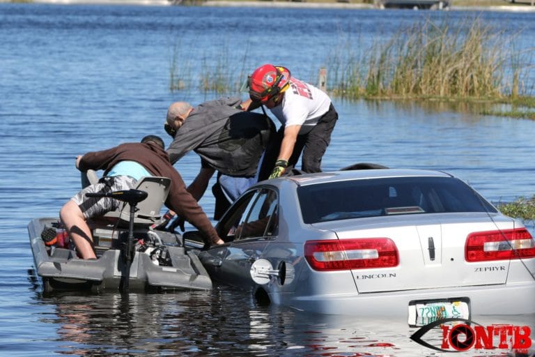 Firefighters and good samaritans rescue two occupants from partially submerged vehicle at Taylor Park in Largo