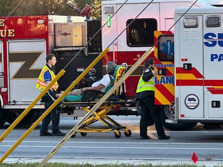 Driver passed out behind the wheel backs into arriving fire truck on Starkey Road