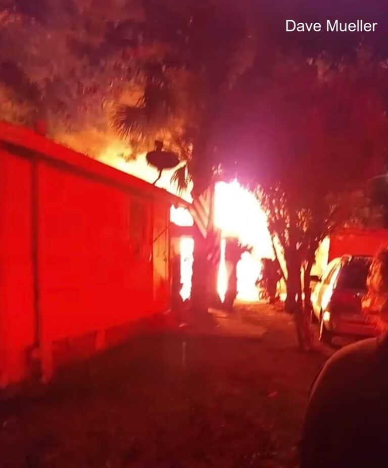 Knife-wielding occupant of a home confesses to arson as firefighters battle blaze